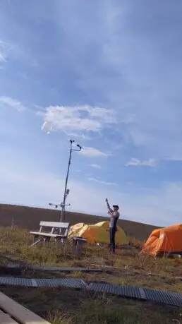 Researcher releasing Windsond to take measurements